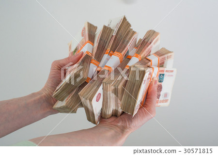 hand holding many of the Russian banknotes hand holding many of the Russian banknotes 30571815