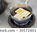 Cooking with Tofu in dashi boil for soup 30572801