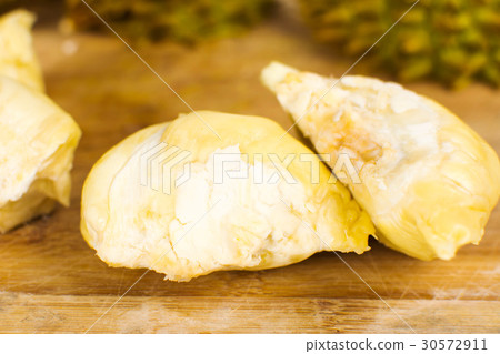 Peeled durian fruit with peel Peeled durian fruit with peel 30572911