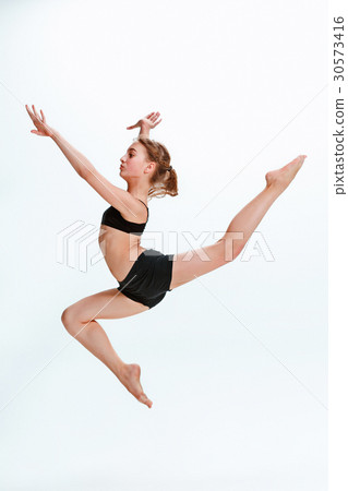 The girl jumping as modern ballet dancer The girl jumping as modern ballet dancer 30573416