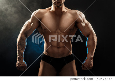 Strong bodybuilder man with perfect abs, shoulders Strong bodybuilder man with perfect abs, shoulders 30575852