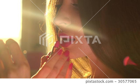 Beautiful young brunette woman using pink lipstick Beautiful young brunette woman using pink lipstick 30577065