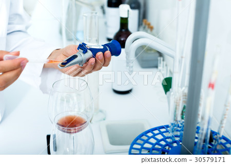 Wine being checked on component saturation in laboratory 30579171