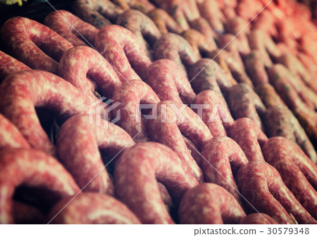 Raw sausage on counter 30579348