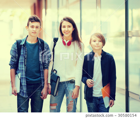 teens going to school with papers teens going to school with papers 30580154