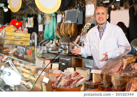 salesman selling cheese and jamon 30580344