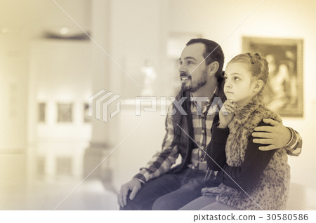 Father and small daughter looking artistic paintings Father and small daughter looking artistic paintings 30580586