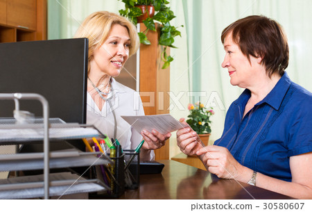 doctor prescribing medication his patient 30580607