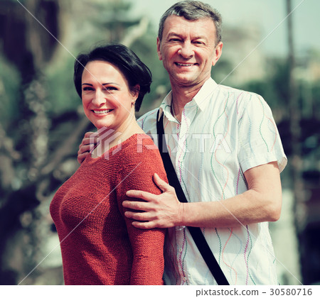 Adult couple in love posing outdoors together 30580716