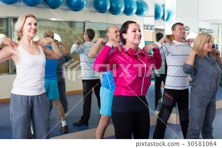 Group of adults doing aerobics exercise in sport club Group of adults doing aerobics exercise in sport club 30581064