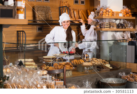 Smiling women at bakery. Smiling women at bakery. 30581113