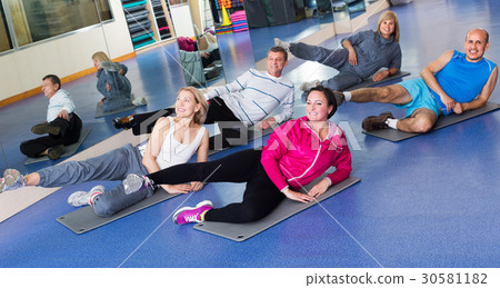 Adults doing pilates routine 30581182