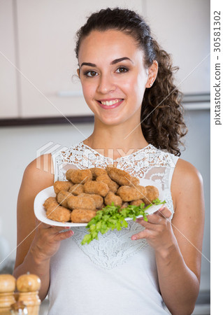 brunette with home-made croquettes brunette with home-made croquettes 30581302