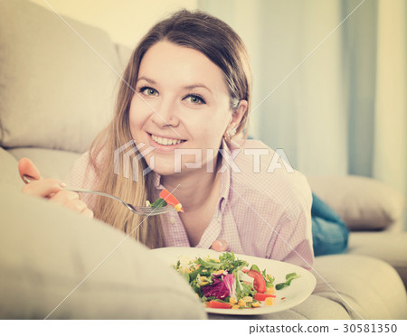 Woman eating salad Woman eating salad 30581350