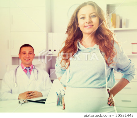 Doctor and pregnant visitor 30581442