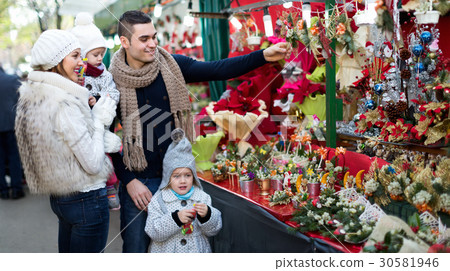 Family of four at Christmas market 30581946