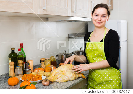 Housewife posing with capon Housewife posing with capon 30582047
