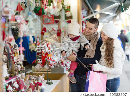 Happy married couple at Catalan Christmas market. 30582207