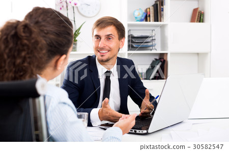 Business male assistant wearing formalwear using laptop 30582547
