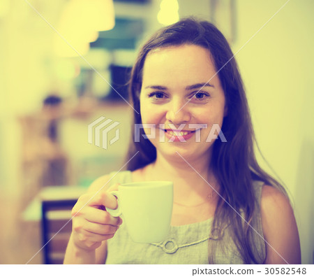 Young girl rests in cafe Young girl rests in cafe 30582548