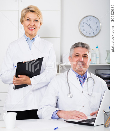 Doctor and nurse waiting for patients 30582683