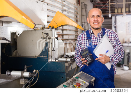 Professional worker in PVC shop. 30583264