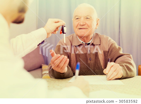 Old man and manager signed contract car lease Old man and manager signed contract car lease 30583592