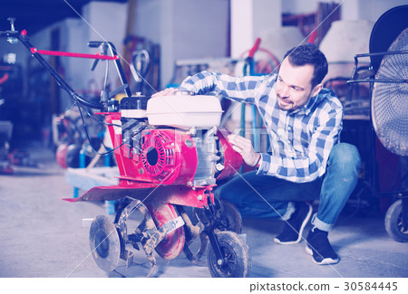 Person is starting to work with plough 30584445