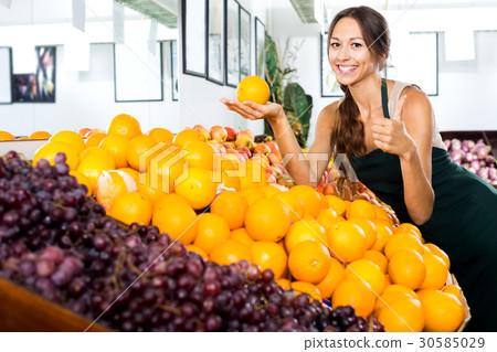 Woman selling fresh oranges on fruit market Woman selling fresh oranges on fruit market 30585029