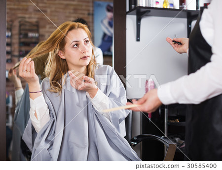 Unhappy woman in hairdress salon 30585400