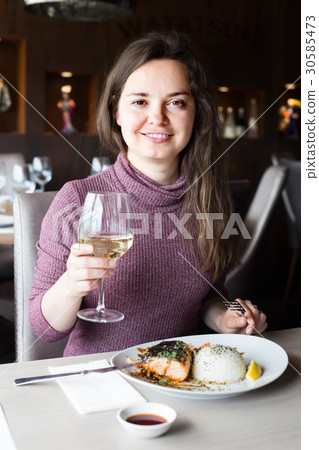 woman sitting in cafe 30585473