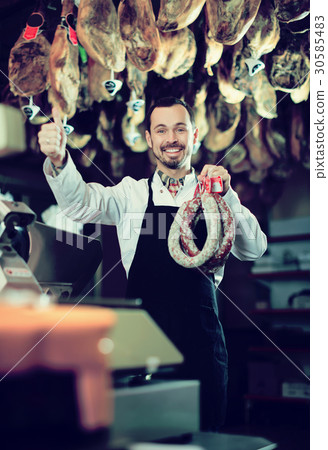 Seller weighing sausage Seller weighing sausage 30585483