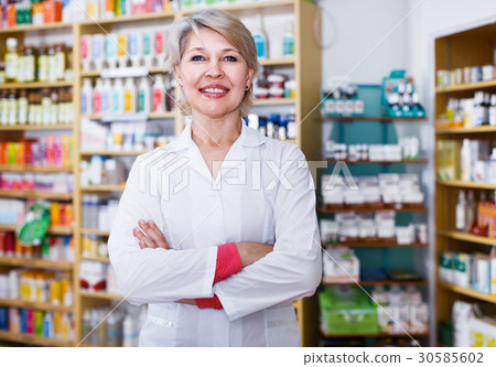 Female seller showing assortment of care products 30585602
