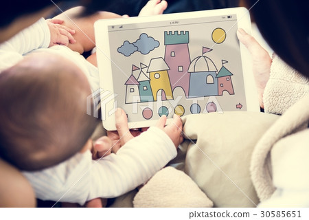 Parents are using digital device sharing to their children. Parents are using digital device sharing to their children. 30585651