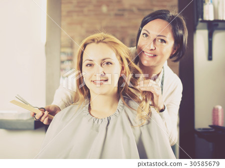 Woman is satisfied with work of master 30585679