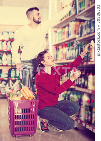 People buying detergents for house People buying detergents for house 30586303