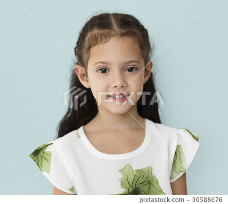 Young little girl with awkward smile expression portrait 30588676