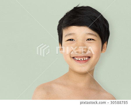 Smiling asian ethnicity boy in a shoot Smiling asian ethnicity boy in a shoot 30588785