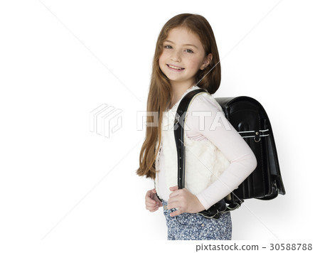 Young freckled girl carrying a backpack smiling portrait Young freckled girl carrying a backpack smiling portrait 30588788