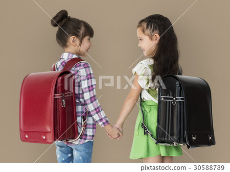Girl and her friend are going to school Girl and her friend are going to school 30588789