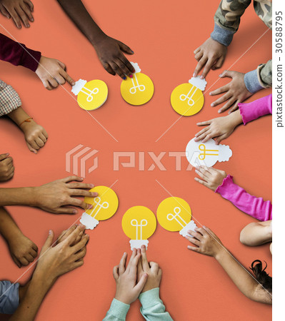 Aerial group of kids hands holding light bulb icon Aerial group of kids hands holding light bulb icon 30588795