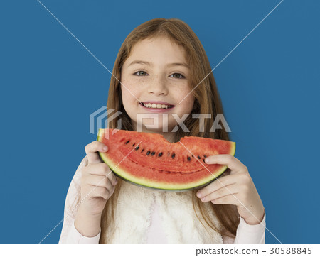 Young cheerful girl holding a slice of watermelon Young cheerful girl holding a slice of watermelon 30588845