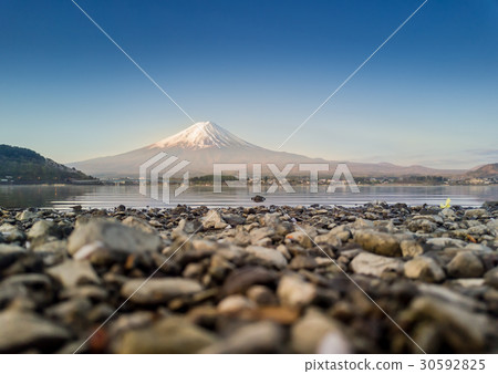 Mountain Fuji reflected in Kawaguchiko lake Mountain Fuji reflected in Kawaguchiko lake 30592825