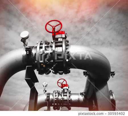 Steel pipelines and valves against blue sky 30593402