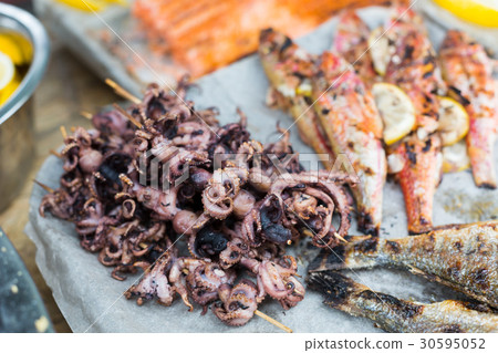 Seafood, fish, octopus grilled at barbecue Seafood, fish, octopus grilled at barbecue 30595052