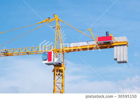 Crane in construction area against blue sky Crane in construction area against blue sky 30595150