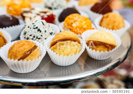 Different candies, cookies and biscuits on banquet 30595191