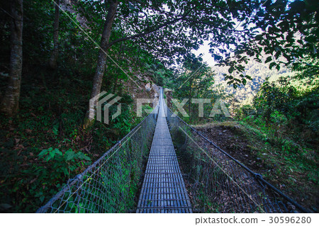Suspension bridge in the mountains Suspension bridge in the mountains 30596280