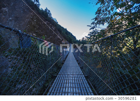 Suspension bridge in the mountains Suspension bridge in the mountains 30596281
