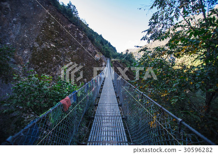 Suspension bridge in the mountains Suspension bridge in the mountains 30596282